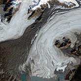 The image of the Bering Glacier were taken in October 1986 and September 2002 derived from the Landsat 5 and Landsat 7 satellites, respectively.