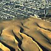 This Landsat image reveals sand dunes advancing on Nouakchott, the capital of Mauritania.