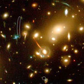 This new galaxy was detected in a long exposure of the nearby cluster of galaxies Abell 2218, taken with the Advanced Camera for Surveys on board the Hubble Space Telescope.